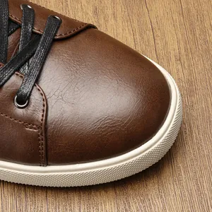 Close-up of brown vintage casual shoe with distressed leather texture and white sole
