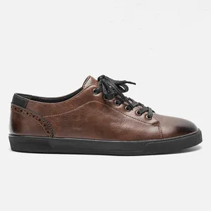 Lateral side view of men's retro polished brown casual shoe on white background