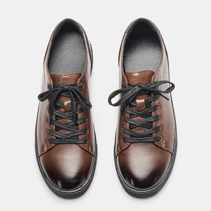 Detailed top view of men's retro brown rub-off casual shoes featuring black laces