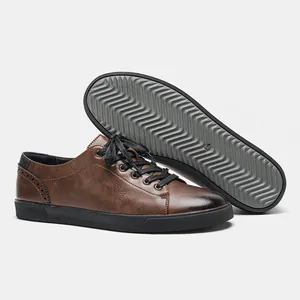 Detailed macro view of men's retro brown casual shoes showing textured gray wavy outsole