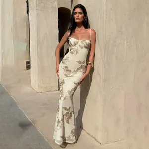 Elegant off-white bodycon maxi dress with exquisite gold floral embroidery details