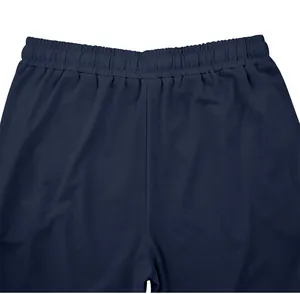 Detail of navy blue men's casual pants showing elastic waistband and fabric.