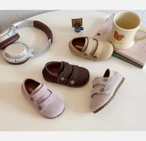 Variety of children's suede walking shoes with double adjustable velcro straps.