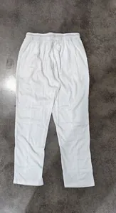 Full view of white men's waffle texture casual pants featuring a breathable grid pattern