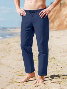 Pantalones de playa de lino azul marino para hombre con cordón y cintura elástica en modelo