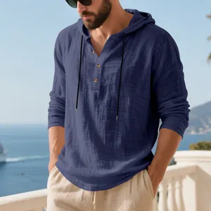 Detailed macro shot of men's navy blue linen hooded Henley shirt with crinkle texture