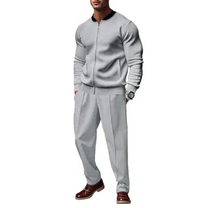 Professional studio shot of a men's gray casual two-piece tracksuit set with a zip-up jacket