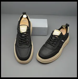 Stylish black and beige men's sneakers featuring a premium leather-like finish.