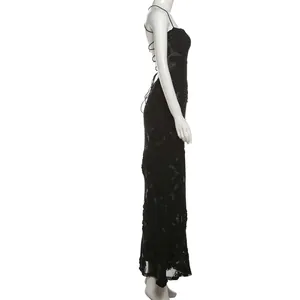 Side profile detail of an elegant black backless lace-up maxi dress on a mannequin