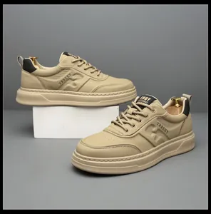 Detailed side view of stylish beige men's sneakers featuring textured leather finish
