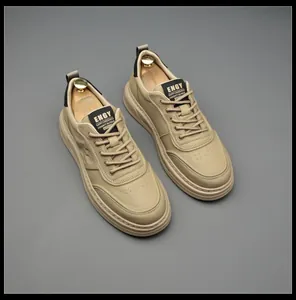 Close-up of premium khaki leather men's sneakers featuring stylish ENGY tongue labels