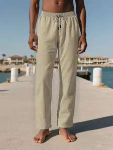 Vista completa de pantalones de playa de lino y algodón beige para hombre con cordón