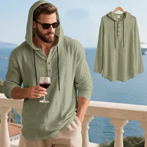 Detail of men's linen hooded Henley long sleeve shirt in olive green for beach wear
