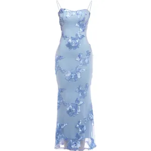 Detail view of light blue mesh dress with floral appliques and spaghetti straps