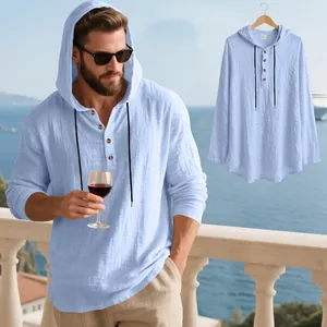 Detail view of a men's light blue breathable linen hooded henley shirt for beach vacations