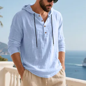 Detail of a light blue men's breathable linen hooded Henley shirt for casual beach wear.