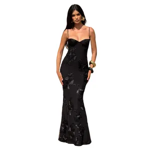 Detailed view of an elegant black mermaid dress with intricate 3D floral appliques.
