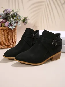 Chic black pointed-toe ankle boots with side zipper and decorative buckle strap detail.