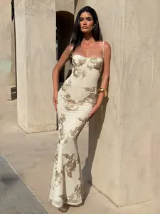 Elegant cream mermaid maxi dress with intricate gold floral embroidery and thin straps