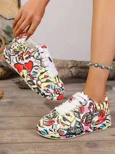 Close-up of vibrant graffiti print on women's thick-soled platform sneakers.