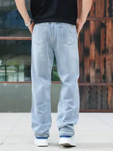 Rear view of loose-fit light blue men's straight-leg jeans featuring a classic back pocket design