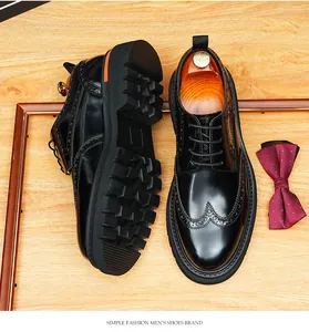 Detail of men's black patent leather brogue Derby shoes with thick anti-slip sole
