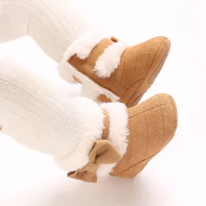 Bottes de neige bébé marron avec fausse fourrure blanche et nœud pour l'hiver