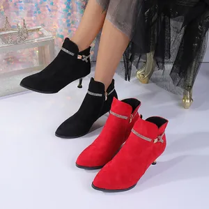 Elegant pointed-toe ankle boots with rhinestone strap detail in black and red.
