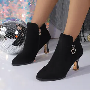 Black pointed toe ankle boots with gold kitten heels and double heart rhinestone charms