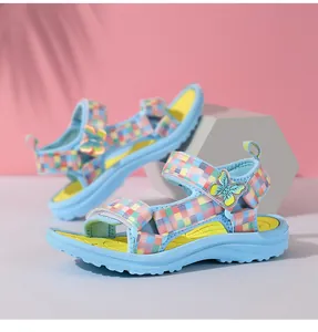 Detailed view of lightweight blue girls' sandals with checkered straps and butterfly décor