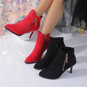 Elegant pointed toe stiletto ankle boots featuring red and black faux suede finish