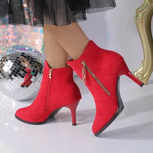 Elegant red suede pointed-toe ankle boots featuring high thin heels and a side zipper