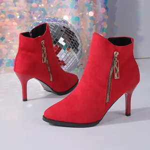 Red suede stiletto ankle boots with gold side zipper and pointed toe detail