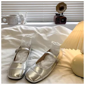 Elegant silver metallic girls Mary Jane princess shoes displayed in a cozy indoor lifestyle setting