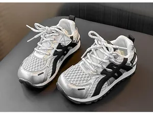 Detailed view of children's breathable silver mesh sneakers with chunky soles
