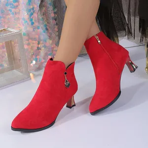 Elegant red suede pointed-toe ankle boots with mid-high heels for chic autumn winter style