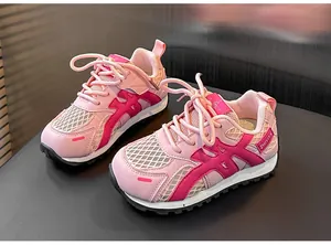 Close-up detail of pink breathable mesh children's sneakers with durable lugged rubber sole.