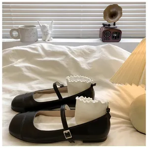 Detailed view of elegant black Mary Jane princess shoes for girls with adjustable buckle straps.
