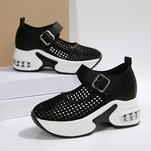 Detailed side view of black breathable mesh platform sandals with comfy wedge heels.