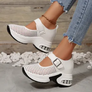 Detailed side view of white mesh platform wedge sneakers for women with air cushion sole.