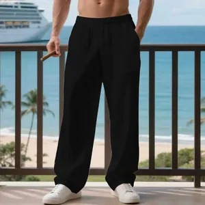 Pantaloni casual da uomo in lino nero con gamba larga e dritta in un resort al mare