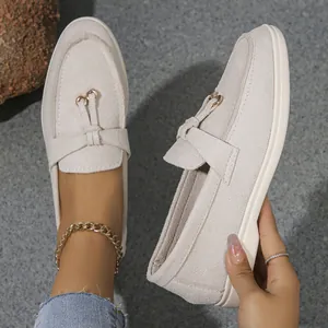 Elegant off-white suede flat loafers for women with stylish gold ring decorative detail