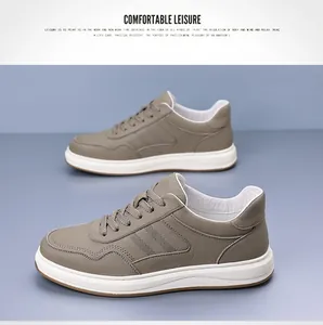 Vista lateral de zapatillas casuales de cuero vacuno caqui para hombre en fondo gris