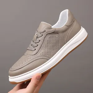 Breathable taupe genuine leather men's casual sneakers featuring a stylish perforated design