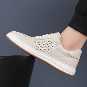 Men's breathable off-white leather sneakers with perforated design and gum sole