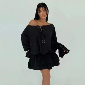 Full view of elegant black off-shoulder lace-up mini dress with flare sleeves detail