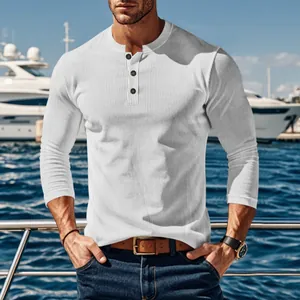 Detail view of men's white long-sleeve Henley shirt with a vertical corduroy texture.