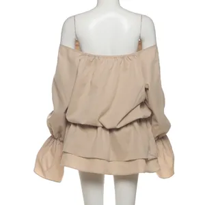 Back view of a sexy off-shoulder beige dress with flared bell sleeves on a mannequin.