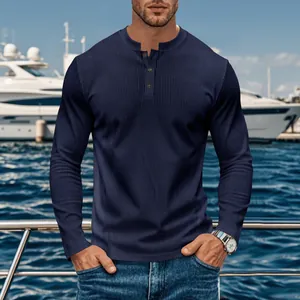 Detail view showing the ribbed texture of a navy blue corduroy Henley shirt for men.