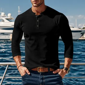 Detailed view of men's black ribbed long-sleeve Henley shirt with front buttoning.
